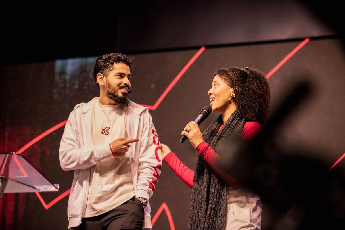 Hosts wearing Be One merch on stage